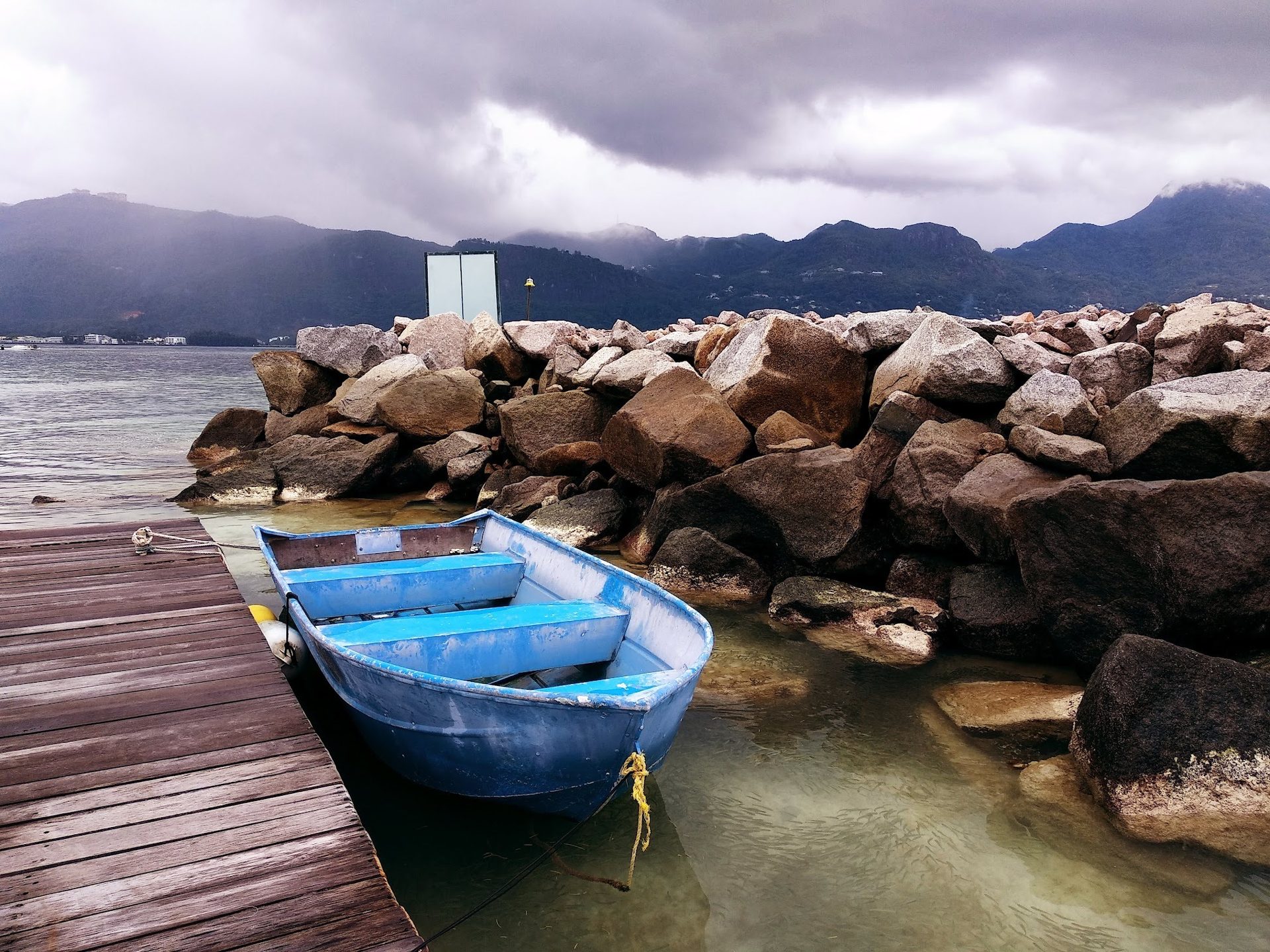 Boats and boating--Equipment and supplies, Body of water, Sky, Cloud, Azure, Boat, Mountain, Vehicle, Wood