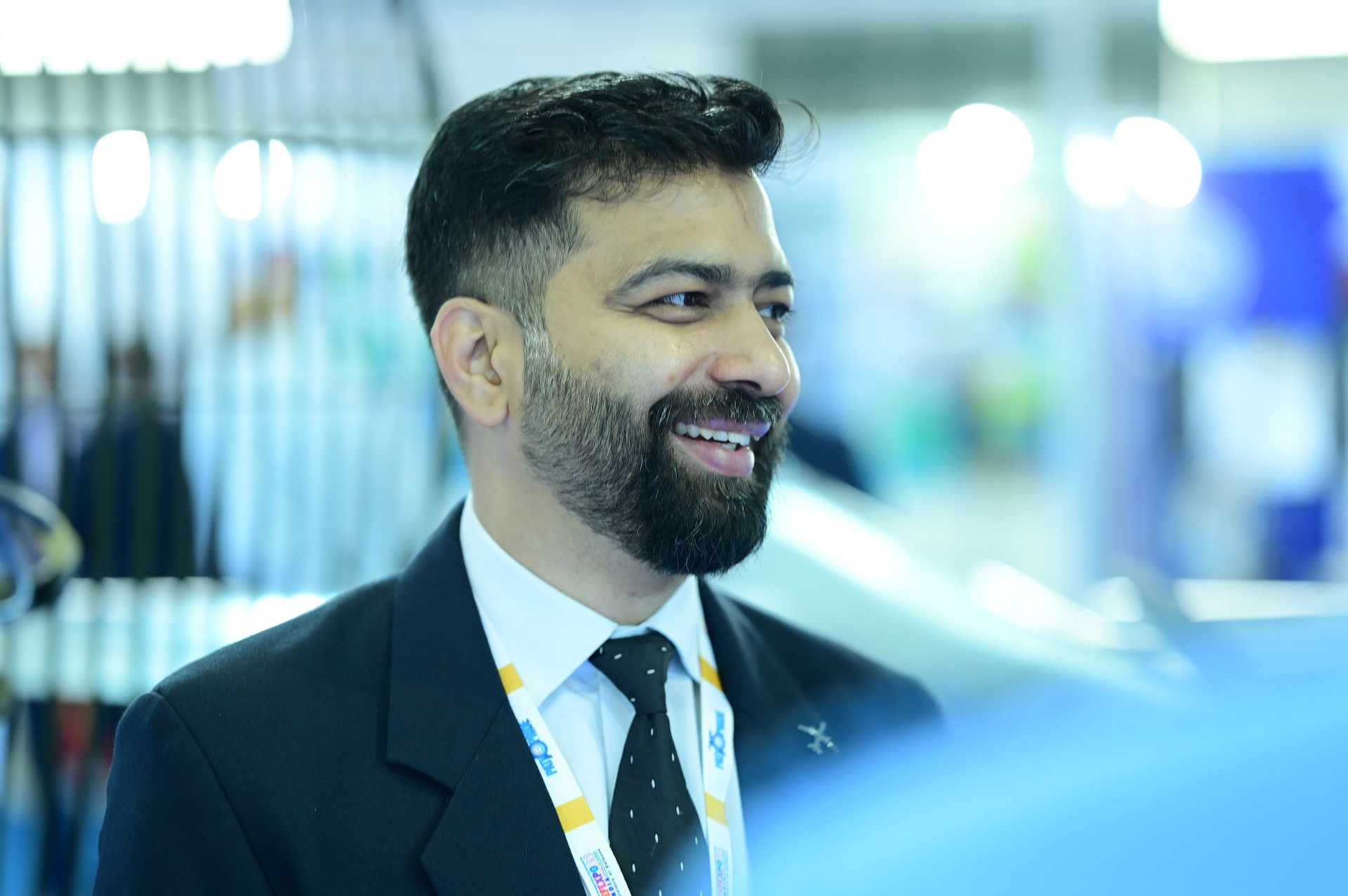 Dress shirt, Automotive design, Flash photography, Smile, Coat, Beard, Tie, Happy, Suit