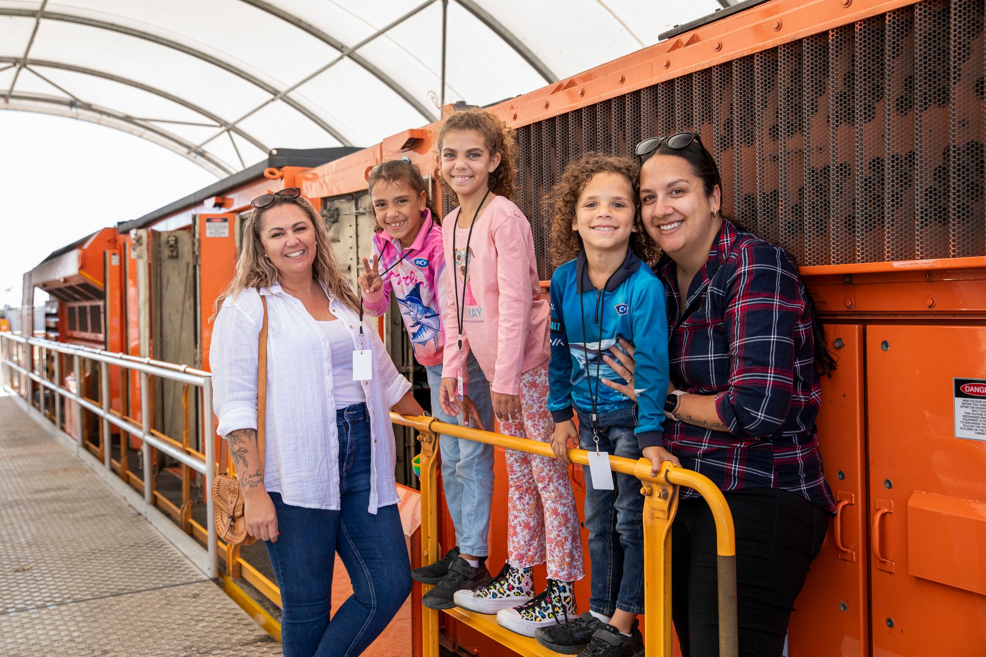 Social group, Smile, Workwear, Orange