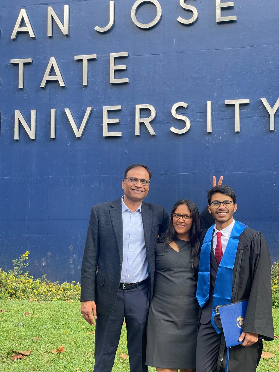 Natural environment, Smile, Outerwear, Photograph, Coat, Tie, Plant, Community