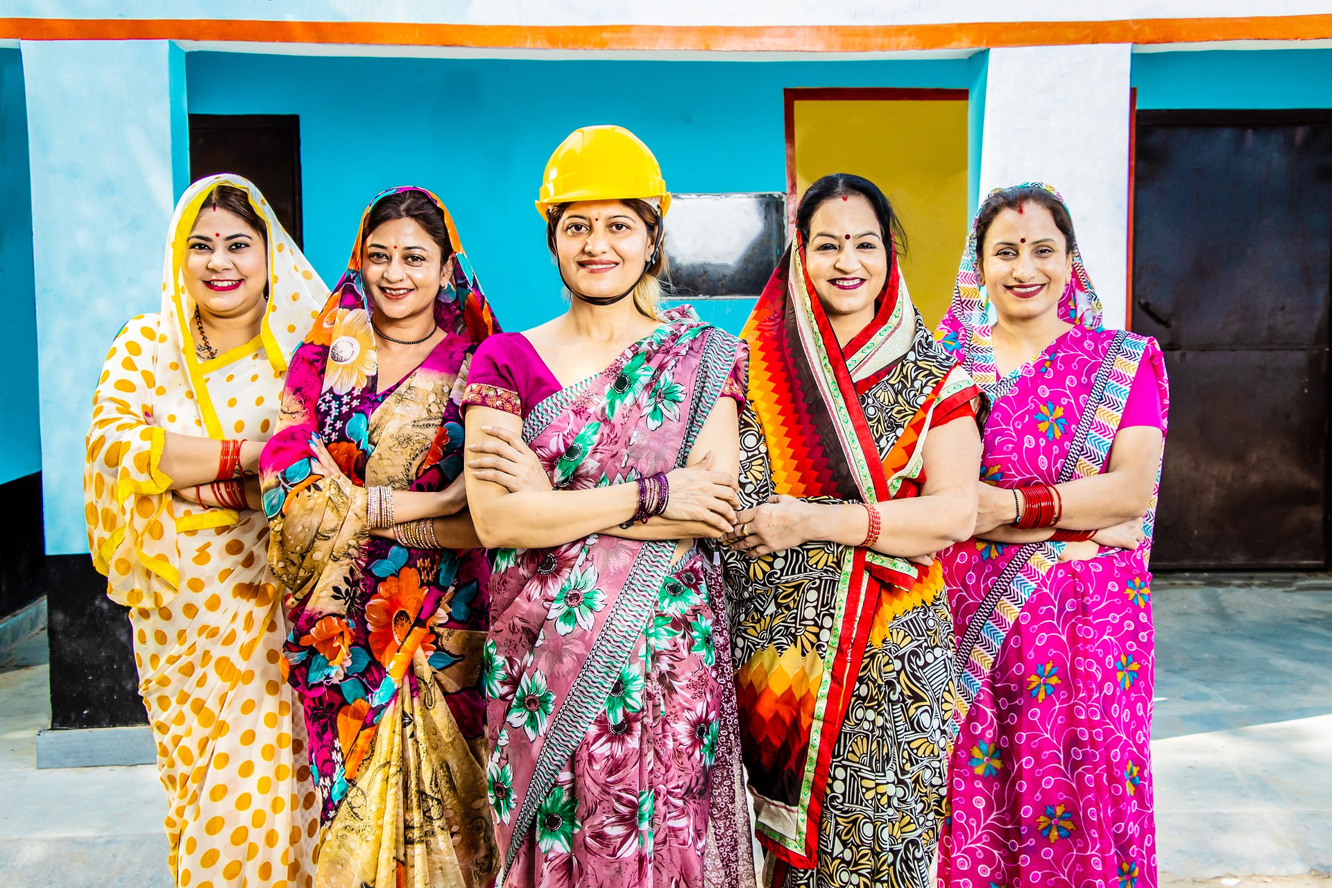 Facial expression, Social group, Smile, Skin, Human, Fashion, Temple, Happy, Purple, Entertainment