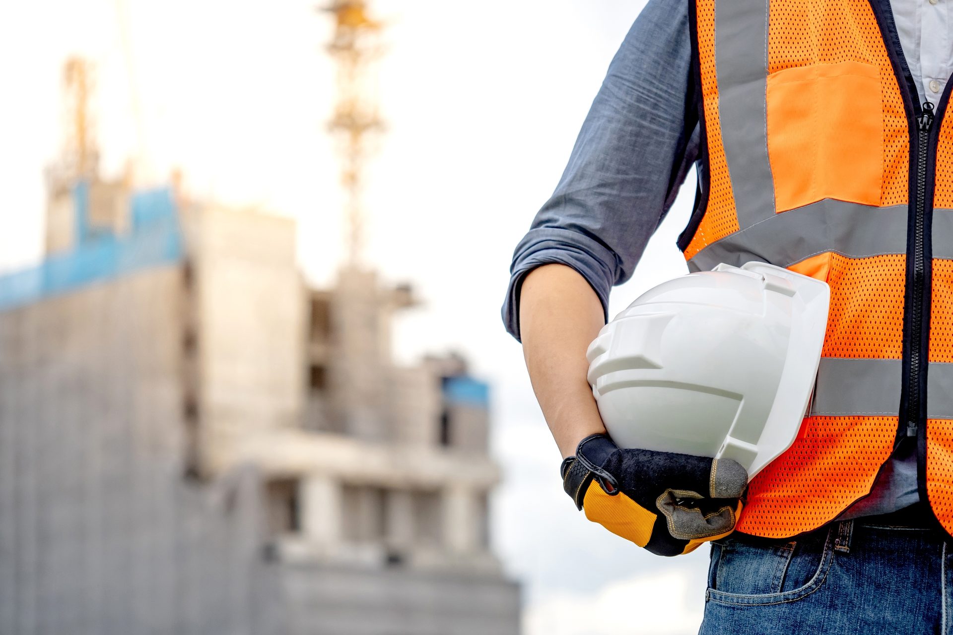 Sports gear, Hand, Glove, Workwear, Sky, Sleeve, Orange, Gesture, Waist, Headgear