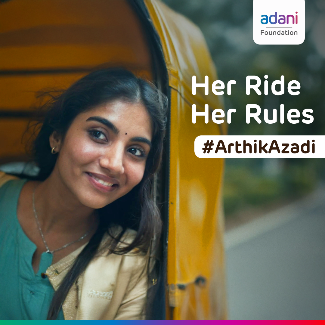 Smiling woman in auto-rickshaw. Text: "Her Ride Her Rules" & "#ArthikAzadi". Adani Foundation logo.