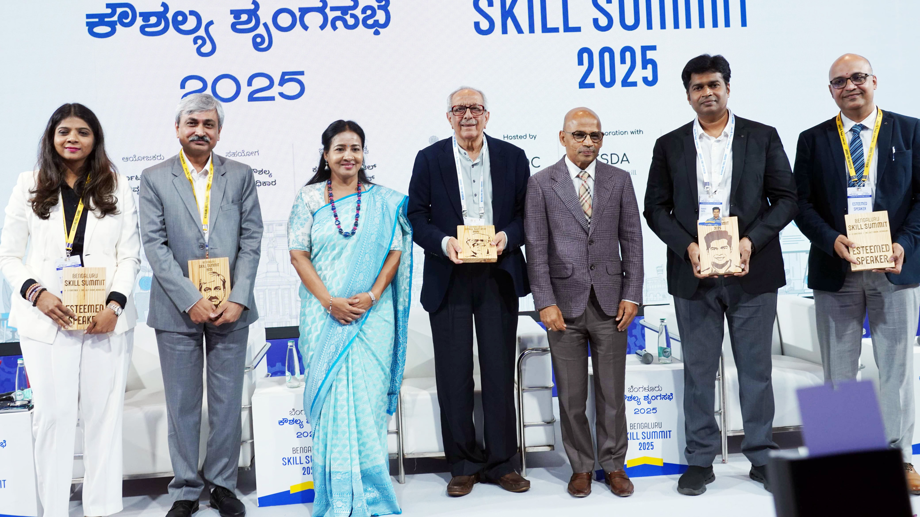 Seven speakers receiving awards at the Bengaluru Skill Summit 2025.