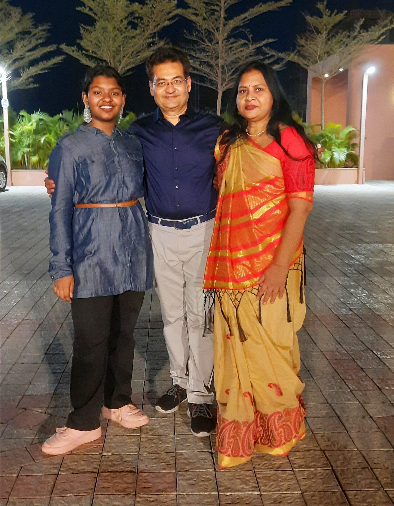 Formal wear, Smile, Temple, Standing, Textile, Sari, Waist, Happiness