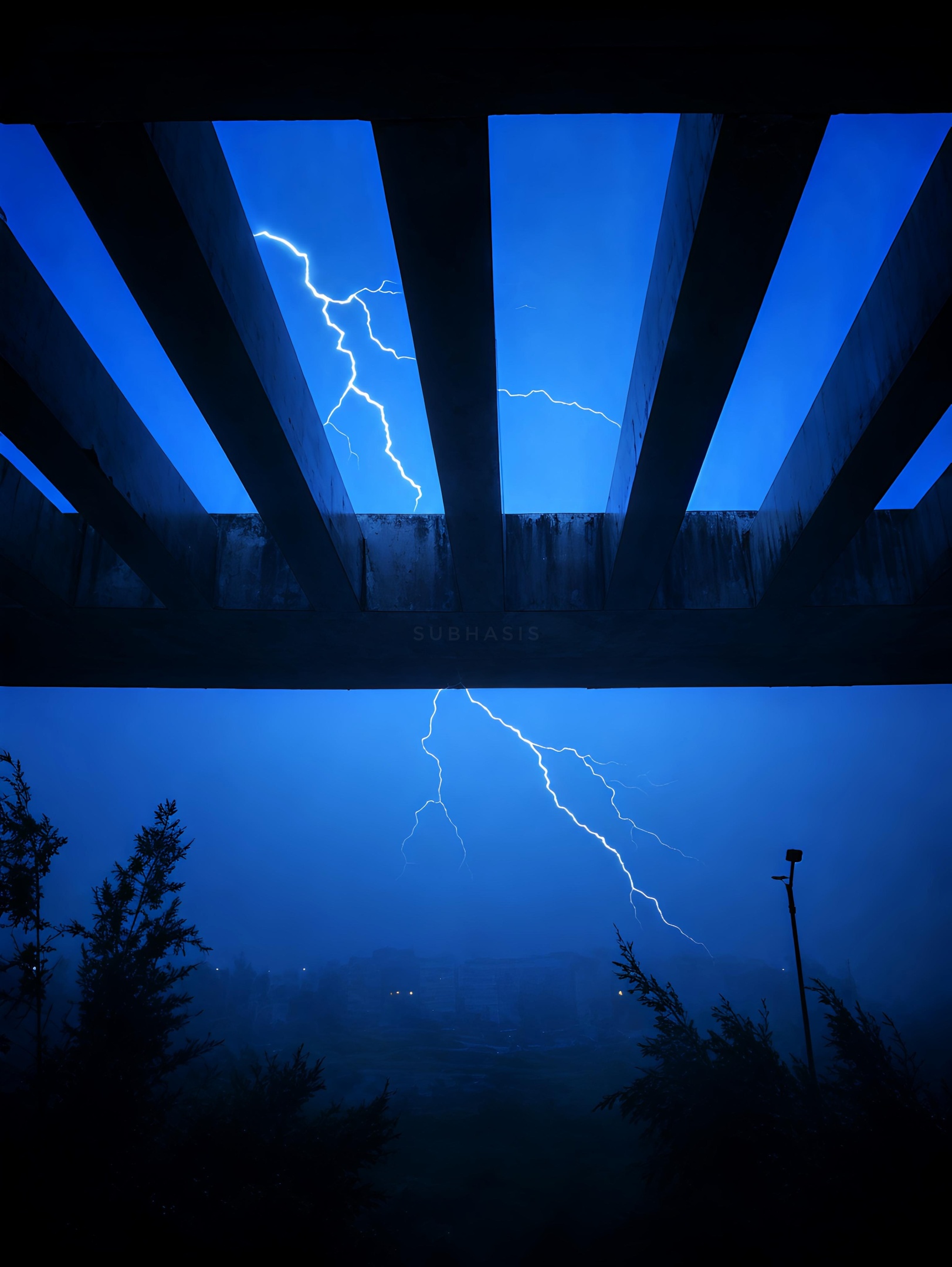 Two powerful lightning bolts illuminate a dark blue sky, framed by a pergola and stormy landscape.