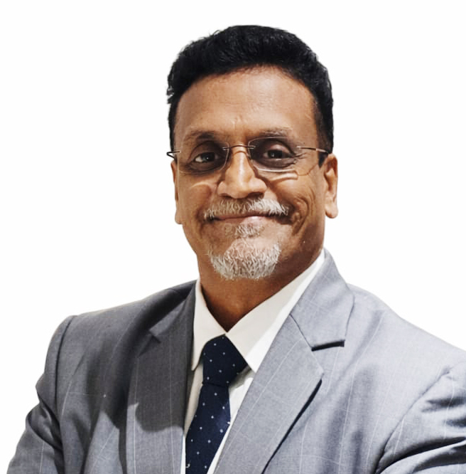 Smiling professional man with glasses, mustache, and goatee, wearing a suit and tie.