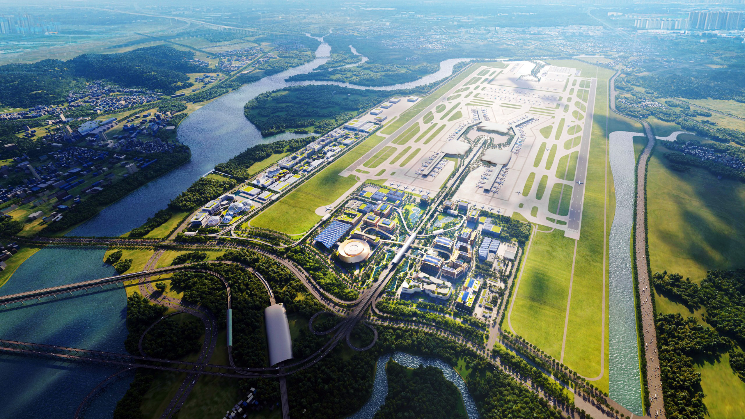 An aerial view of a massive modern airport complex featuring multiple runways, terminals, and surrounding green areas, with a river winding around it.