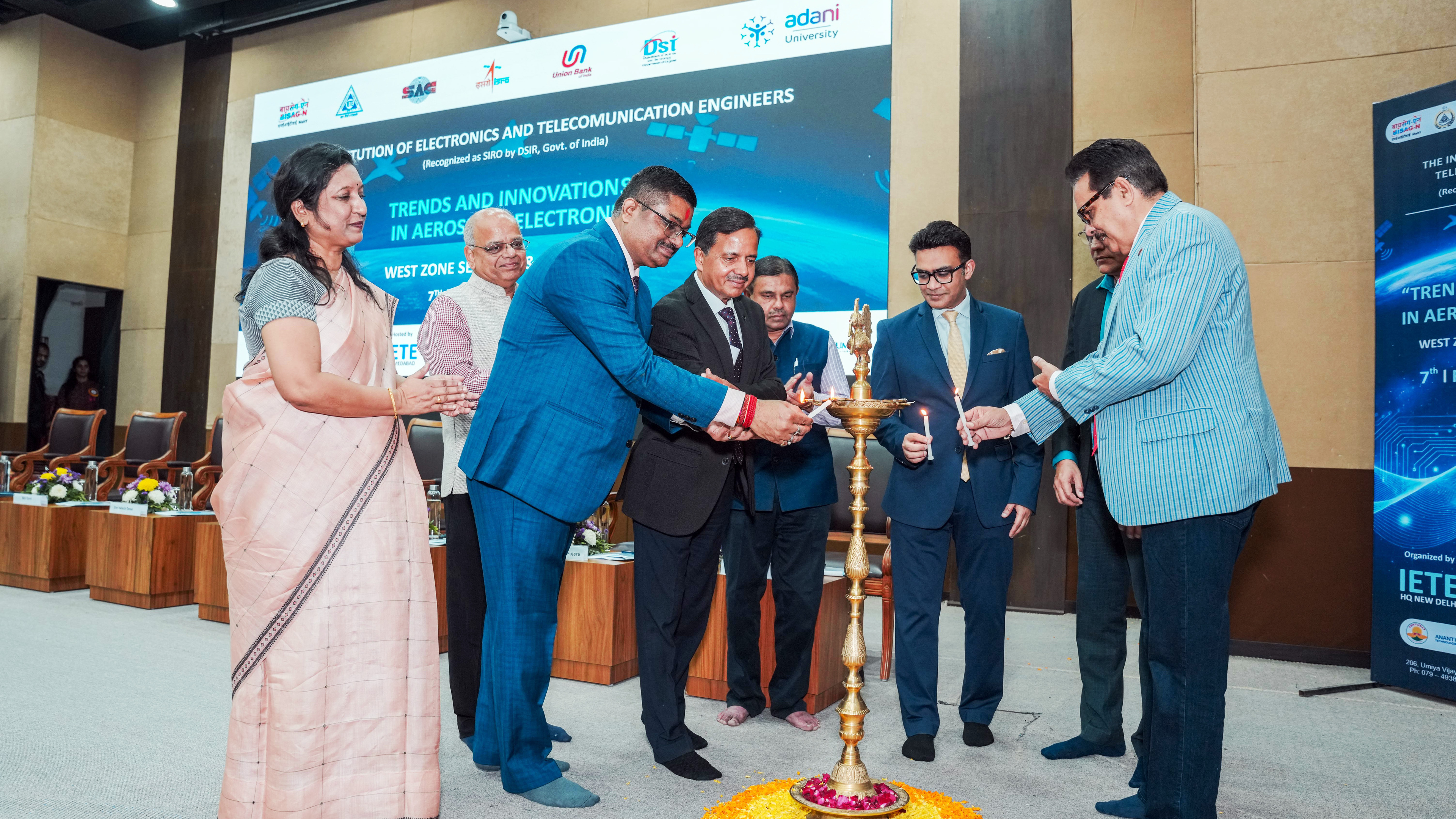 People light a traditional lamp at "Trends and Innovations in Aeros Electron" event by IETE.