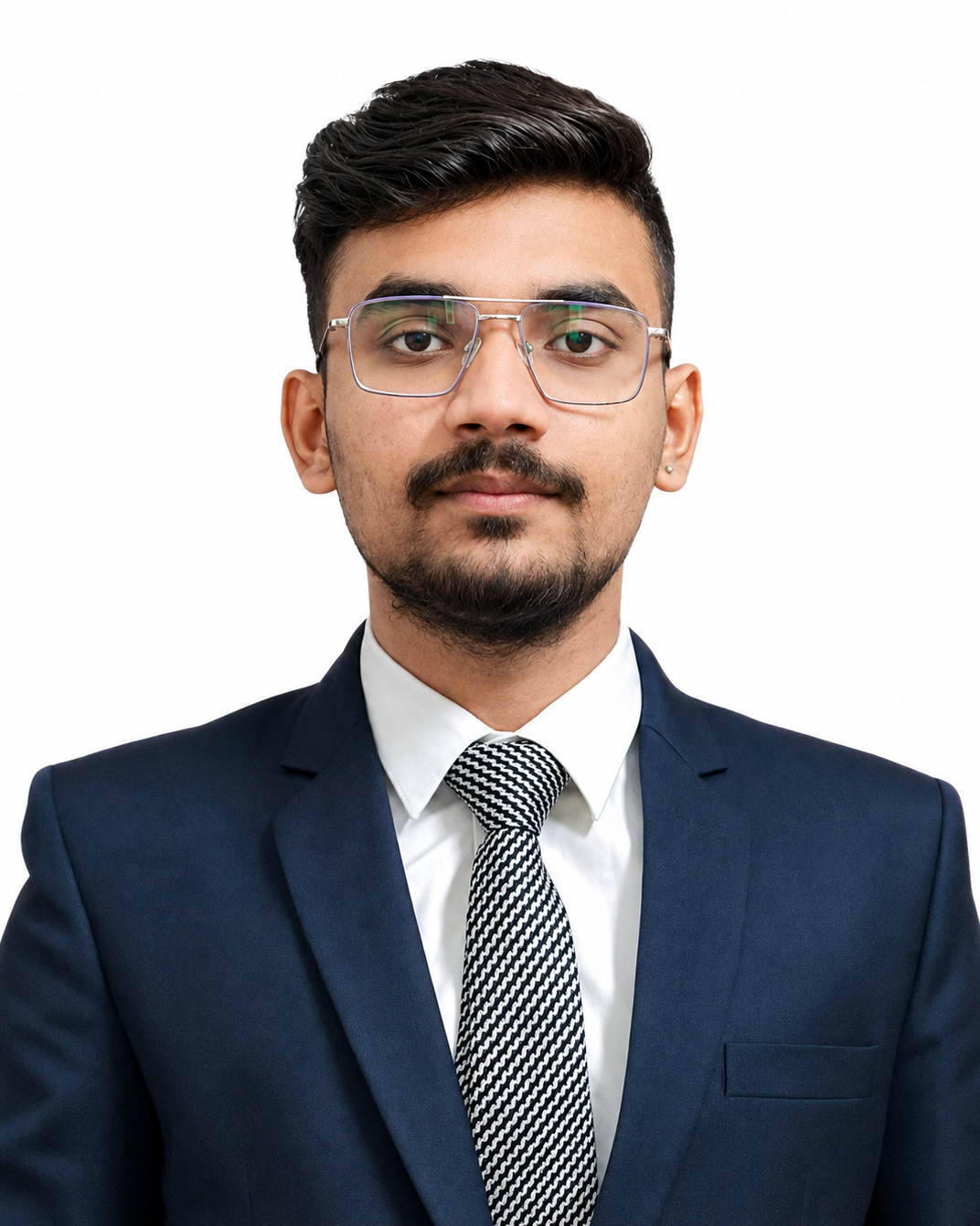 Young man in a blue suit, white shirt, black and white tie, and glasses looking forward.