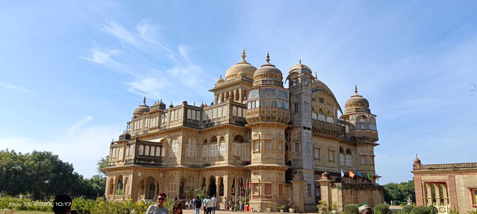 A grand, ornate palace with multiple domes and intricate architecture under a clear blue sky.