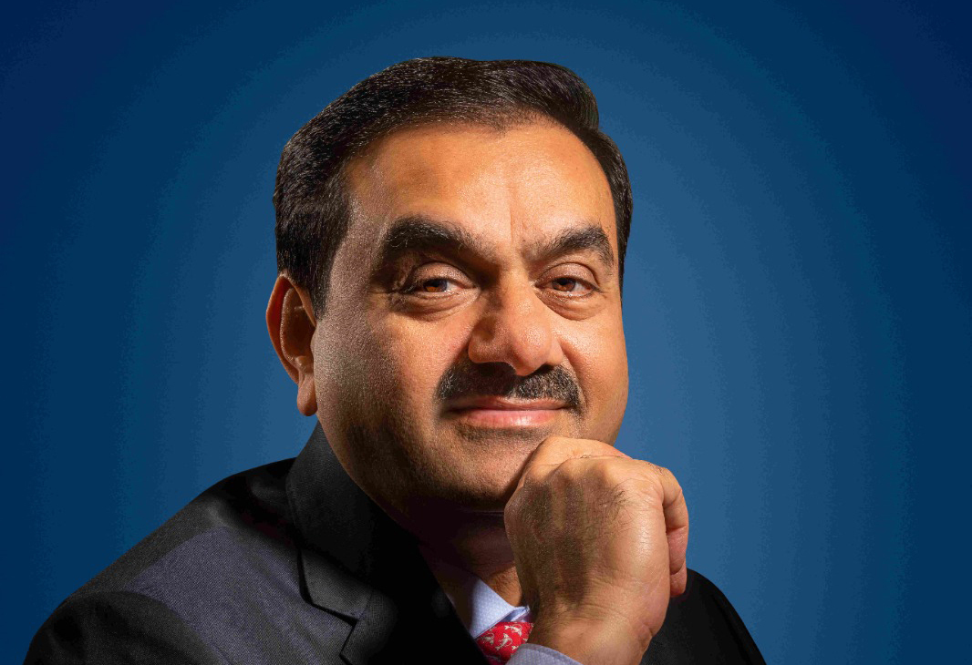 Gautam Adani, an Indian business magnate, smiling directly at the viewer.