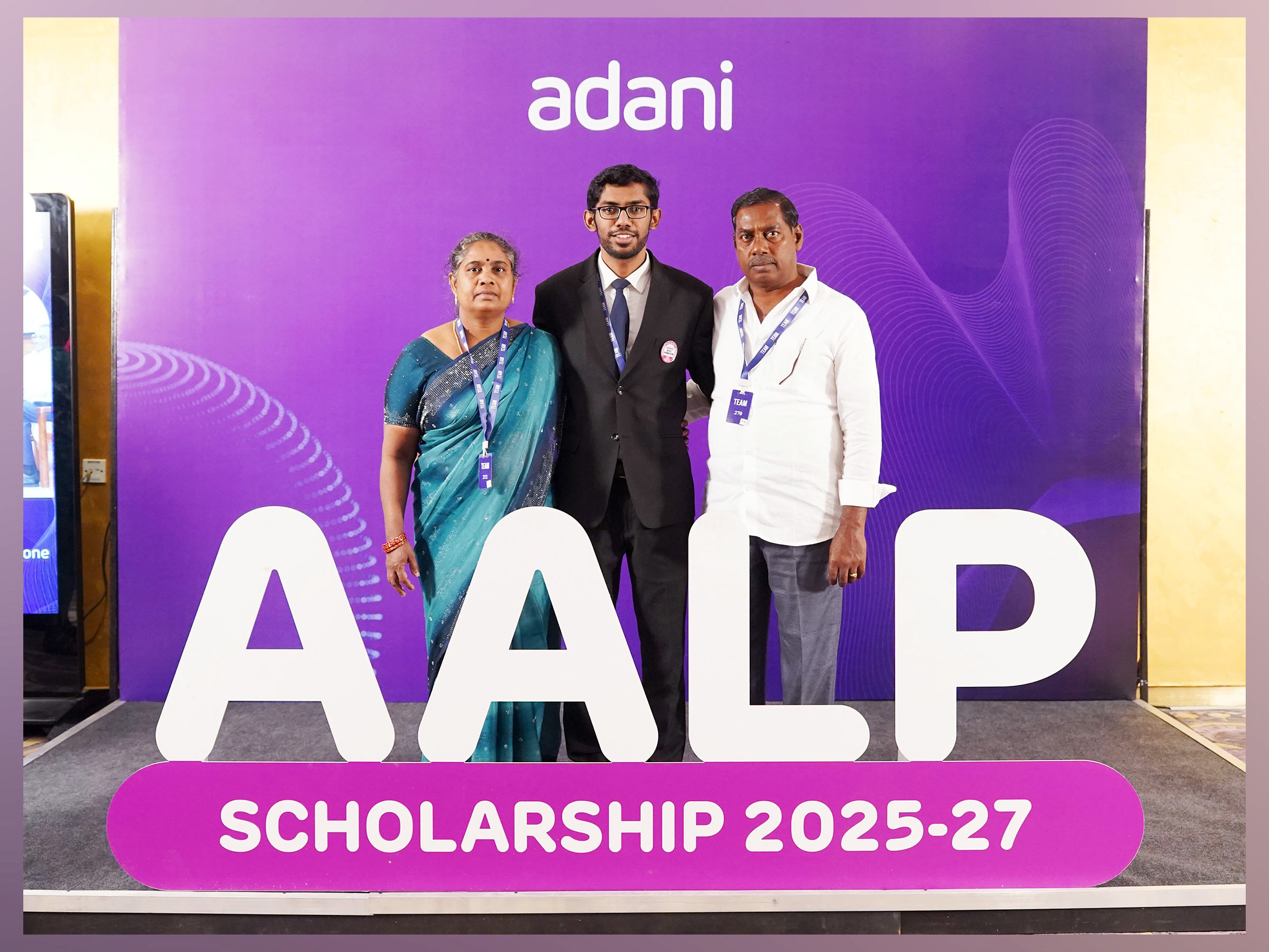 Scholarship recipient with family at an Adani AALP Scholarship event.