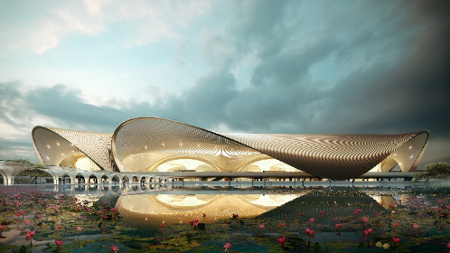 Modern curvilinear building with golden facade reflected in a water body filled with pink lotus flowers.
